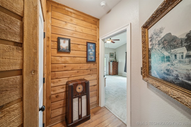 hallway with light hardwood / wood-style floors