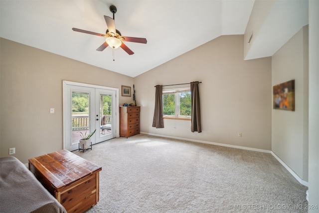 sitting room featuring a wealth of natural light, vaulted ceiling, ceiling fan, and french doors