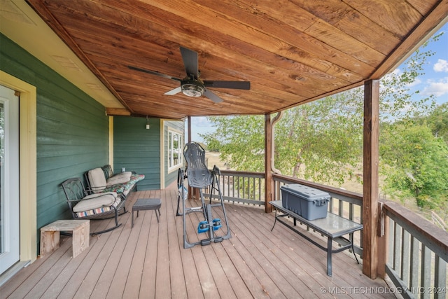 wooden terrace featuring ceiling fan