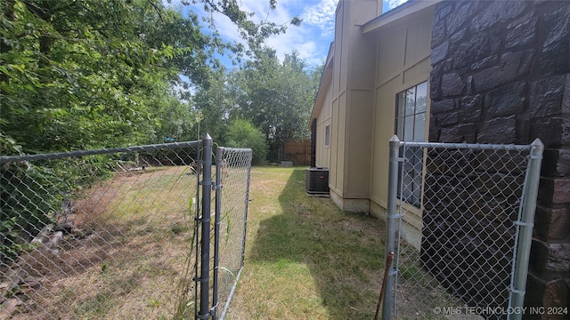 view of yard with central AC unit