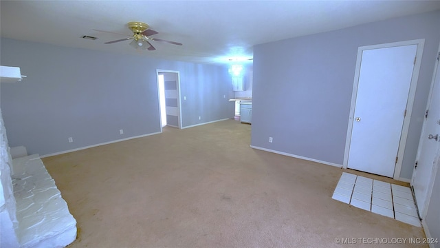 unfurnished room with light carpet and ceiling fan