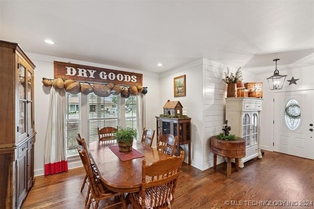 dining space featuring dark hardwood / wood-style flooring