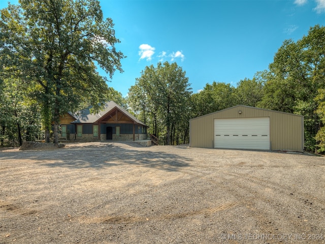 view of front facade with an outdoor structure and a garage