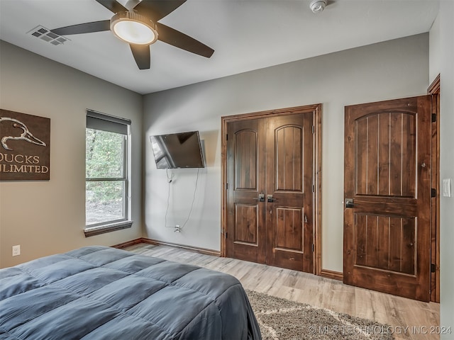 bedroom featuring ceiling fan and light wood-type flooring