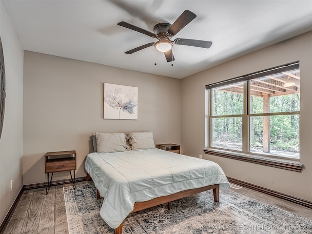 bedroom featuring wood-type flooring and ceiling fan