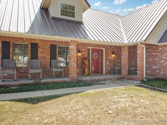 entrance to property with covered porch