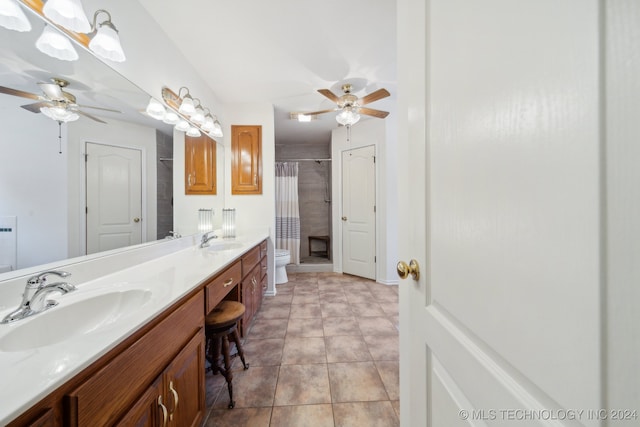 bathroom featuring ceiling fan, curtained shower, tile patterned floors, toilet, and vanity