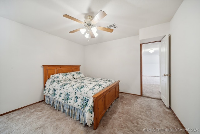 bedroom with light carpet and ceiling fan