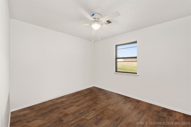 unfurnished room featuring ceiling fan, a textured ceiling, and dark hardwood / wood-style flooring