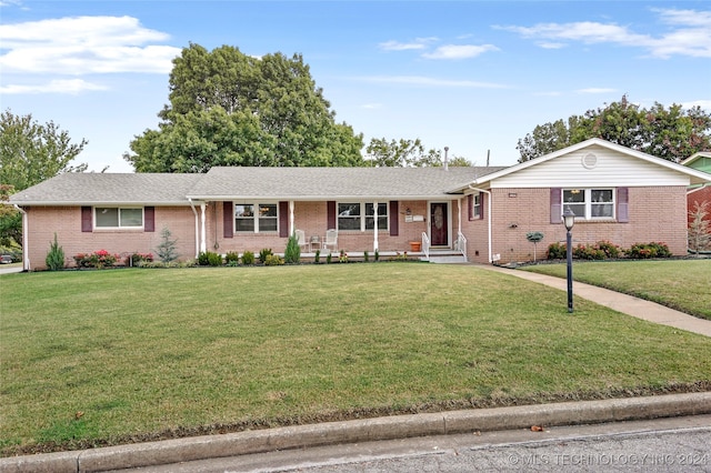 ranch-style house with a front lawn