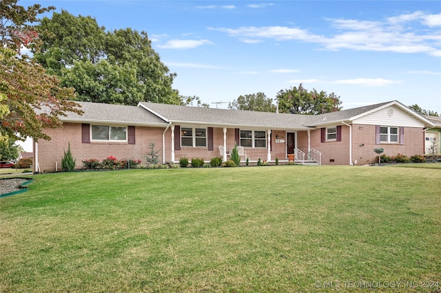 ranch-style house featuring a front yard