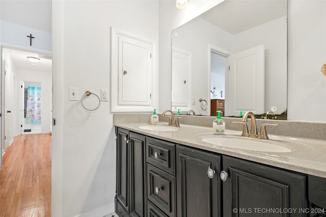 bathroom featuring vanity and hardwood / wood-style floors