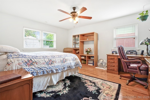 bedroom with ceiling fan and hardwood / wood-style floors