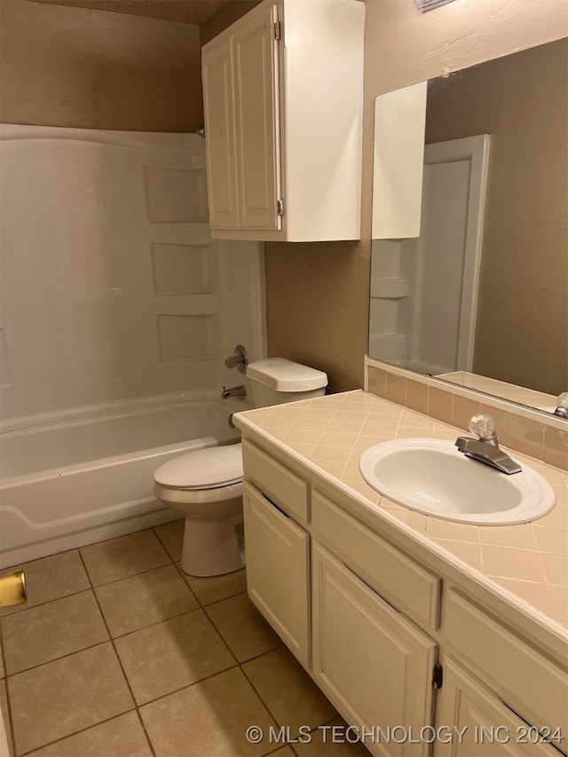 full bathroom featuring shower / tub combination, vanity, toilet, and tile patterned floors