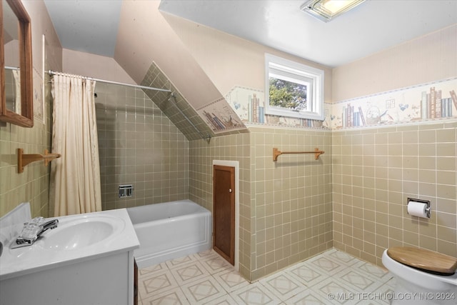 full bathroom featuring shower / bathtub combination with curtain, tile walls, vanity, and toilet