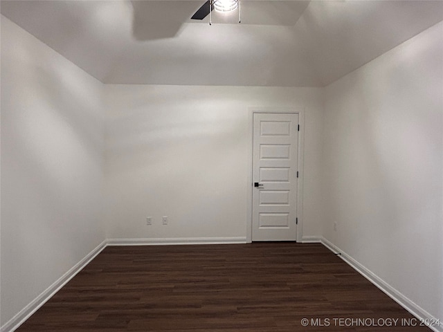 unfurnished room featuring ceiling fan and dark hardwood / wood-style floors