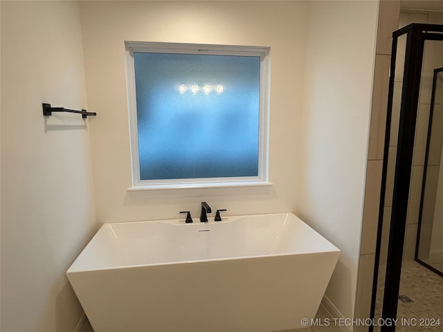 bathroom with a tub