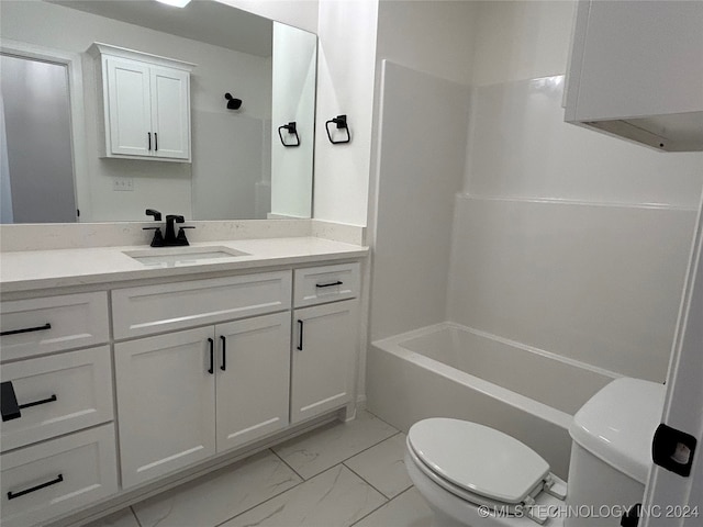 full bathroom featuring toilet, washtub / shower combination, and vanity