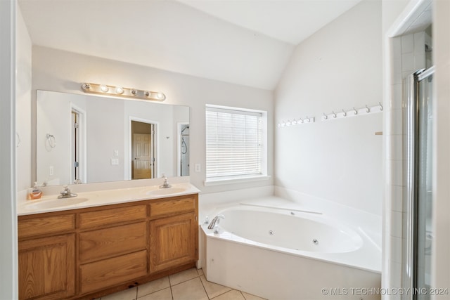 bathroom featuring tile patterned floors, vanity, independent shower and bath, and vaulted ceiling