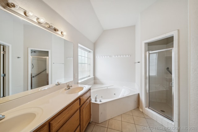 bathroom featuring independent shower and bath, vanity, tile patterned floors, and lofted ceiling