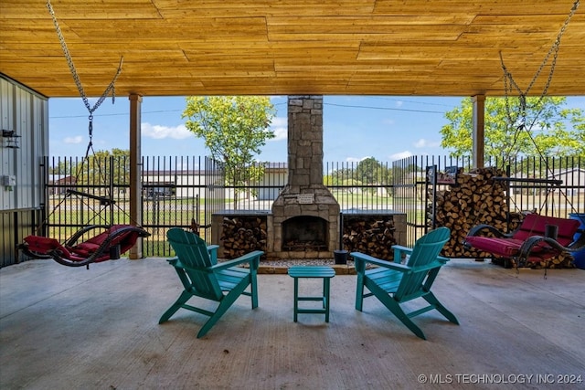 view of patio / terrace with an outdoor stone fireplace