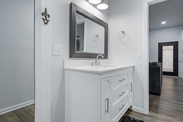 bathroom featuring vanity and hardwood / wood-style flooring