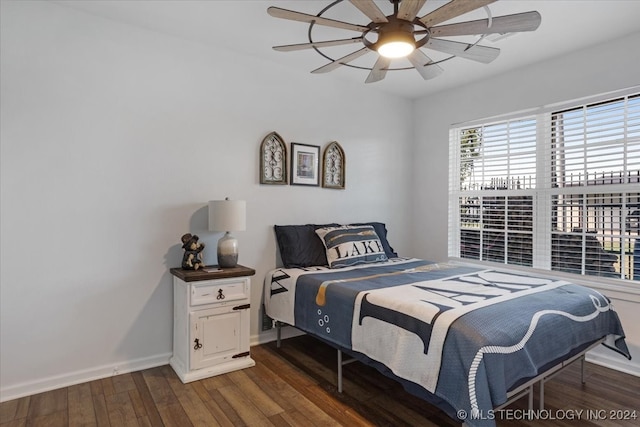 bedroom with dark wood-type flooring and ceiling fan