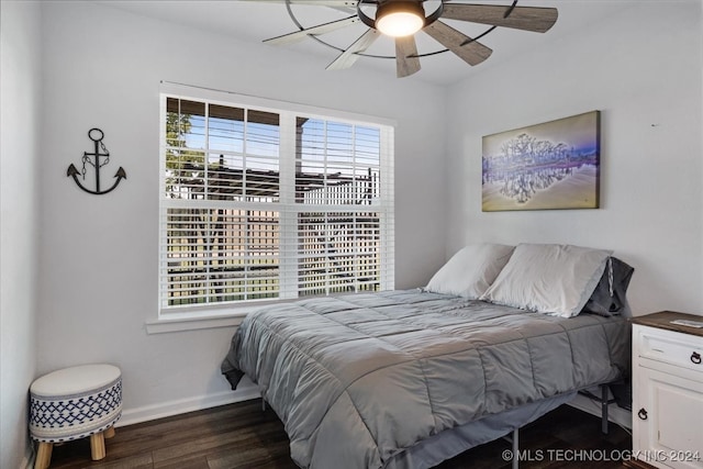 bedroom featuring ceiling fan and dark hardwood / wood-style floors