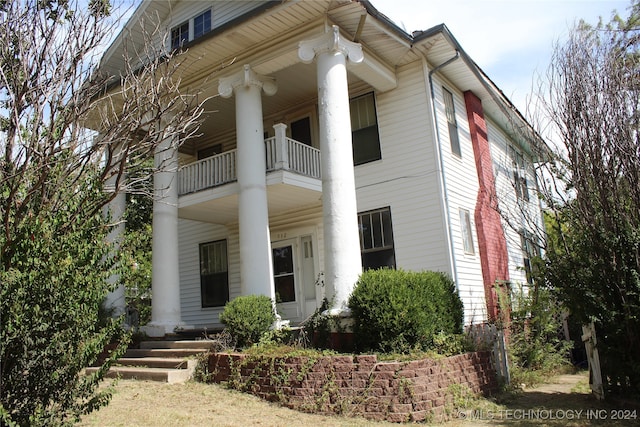 view of front of home with a balcony