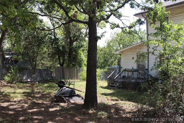 view of yard featuring a wooden deck