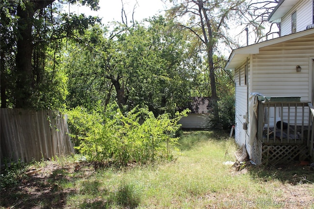 view of yard with a wooden deck