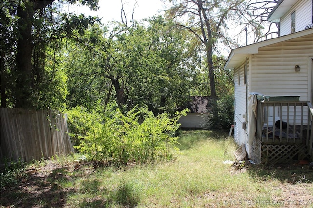 512 N 4th St, Henryetta, OK 74437 - view of yard with a wooden deck and fence
