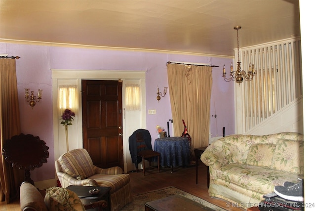 512 N 4th St, Henryetta, OK 74437 - living room featuring a chandelier and wood finished floors
