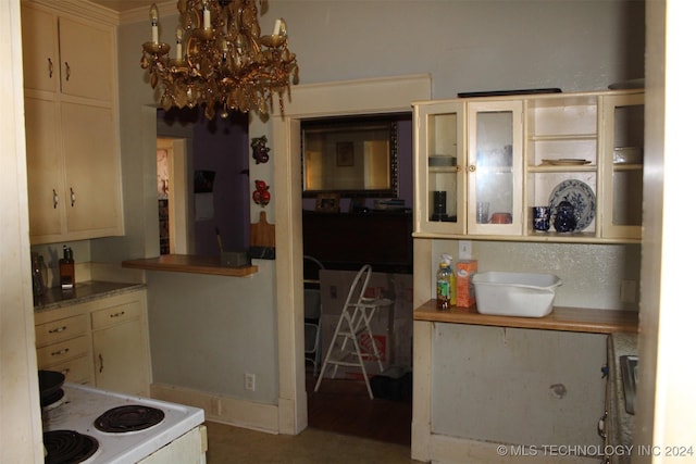 512 N 4th St, Henryetta, OK 74437 - kitchen featuring an inviting chandelier, glass insert cabinets, and white range with electric cooktop