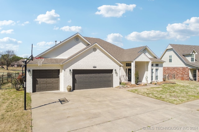 view of front facade with a front lawn and a garage