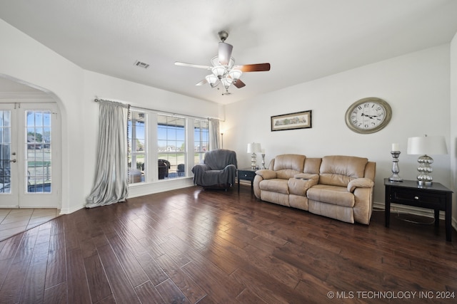 living room with ceiling fan, french doors, dark wood-type flooring, and a healthy amount of sunlight