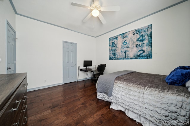 bedroom with ornamental molding, dark hardwood / wood-style flooring, and ceiling fan