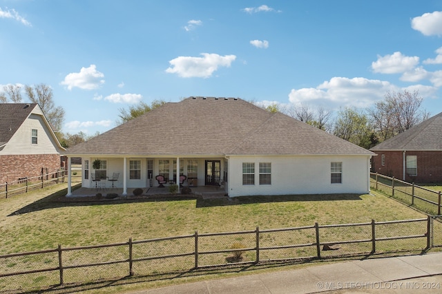 view of front of home with a front yard and a porch