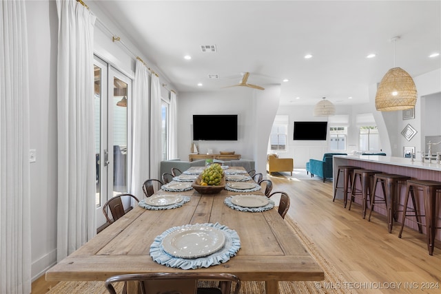 dining area with light hardwood / wood-style floors