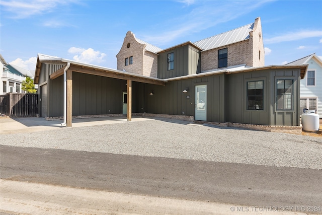 view of front of home with a carport