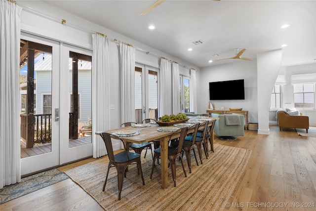 dining space featuring light hardwood / wood-style flooring and french doors