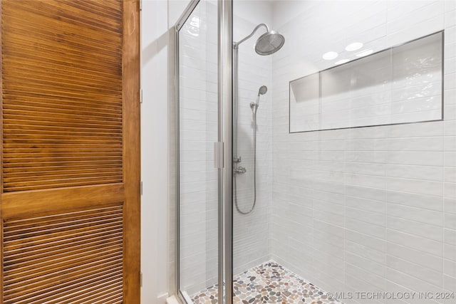 bathroom featuring an enclosed shower