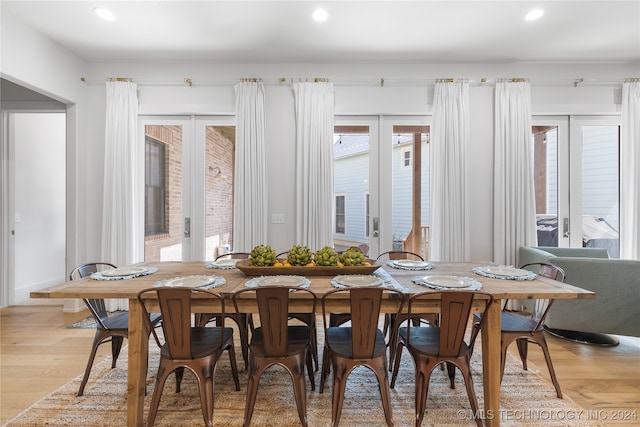 dining room featuring light hardwood / wood-style flooring and french doors