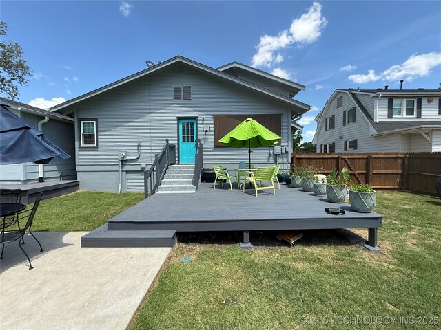 1433 S Dewey Ave, Bartlesville, OK 74003 - back of property with a deck and entry steps