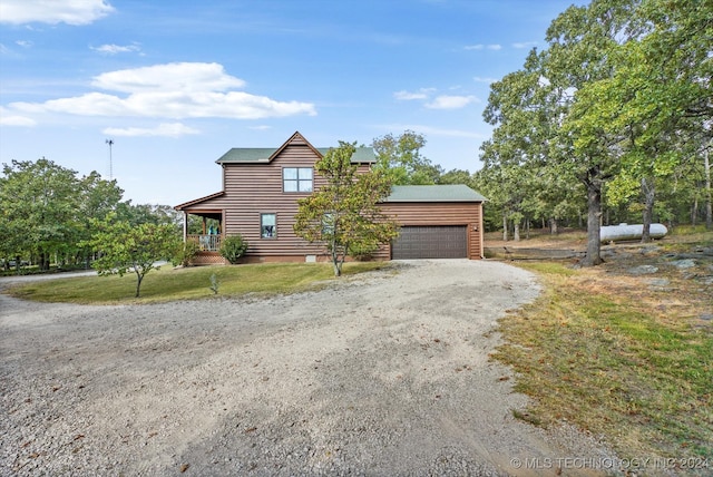 view of front of house with a front lawn and a garage