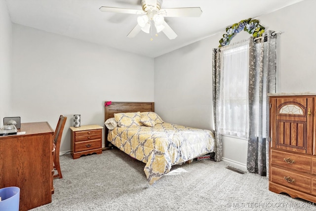 bedroom with ceiling fan and light colored carpet