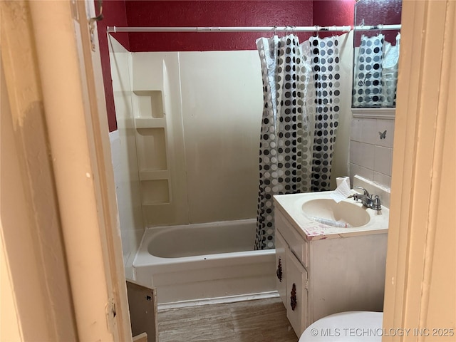 full bathroom featuring shower / tub combo, vanity, toilet, and wood finished floors