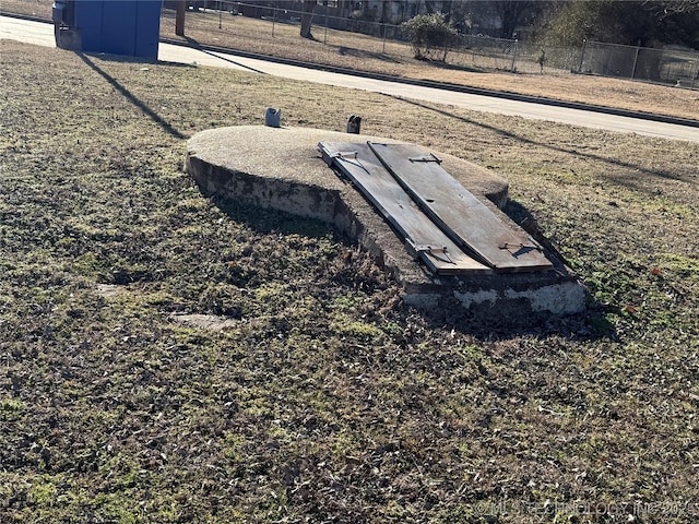 view of storm shelter with fence