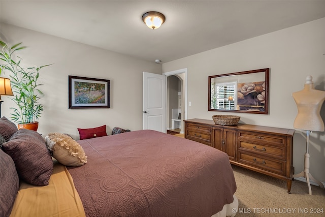 bedroom featuring light carpet