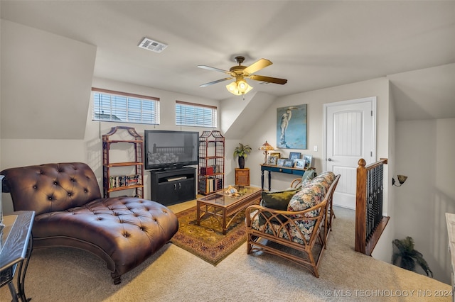 carpeted living room featuring ceiling fan and lofted ceiling